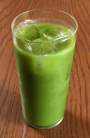 A tall glass of iced matcha