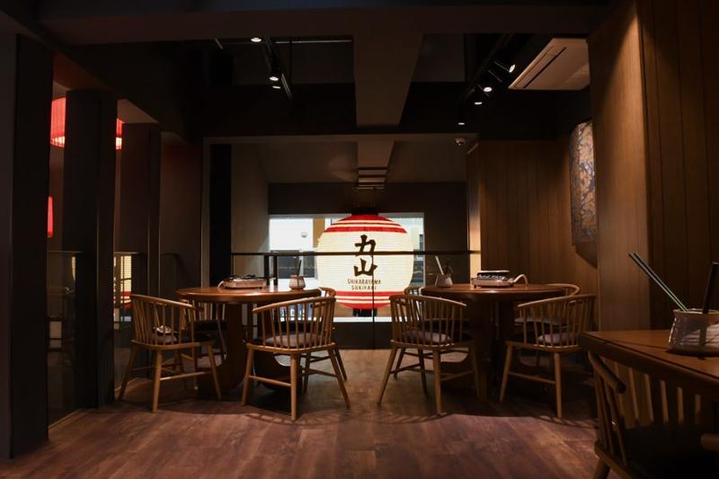 Sanjo Kawaramachi dining room lit by a large paper lantern